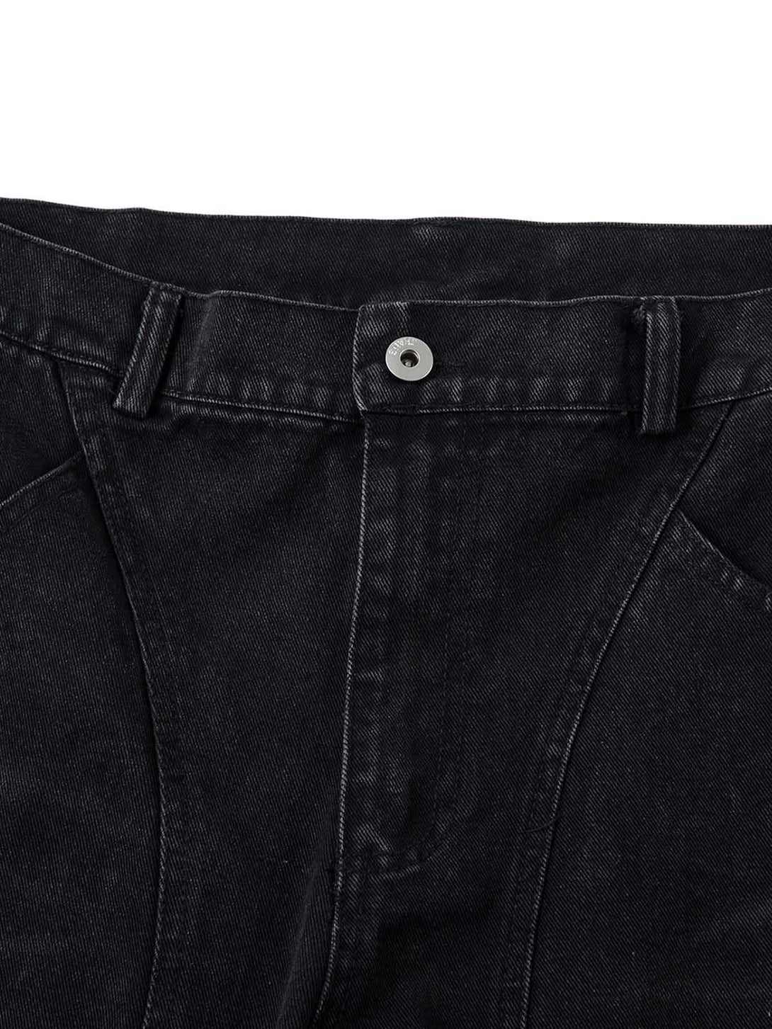 Intricate look at the button and belt loops on TALISHKO's black washed cargo jeans.