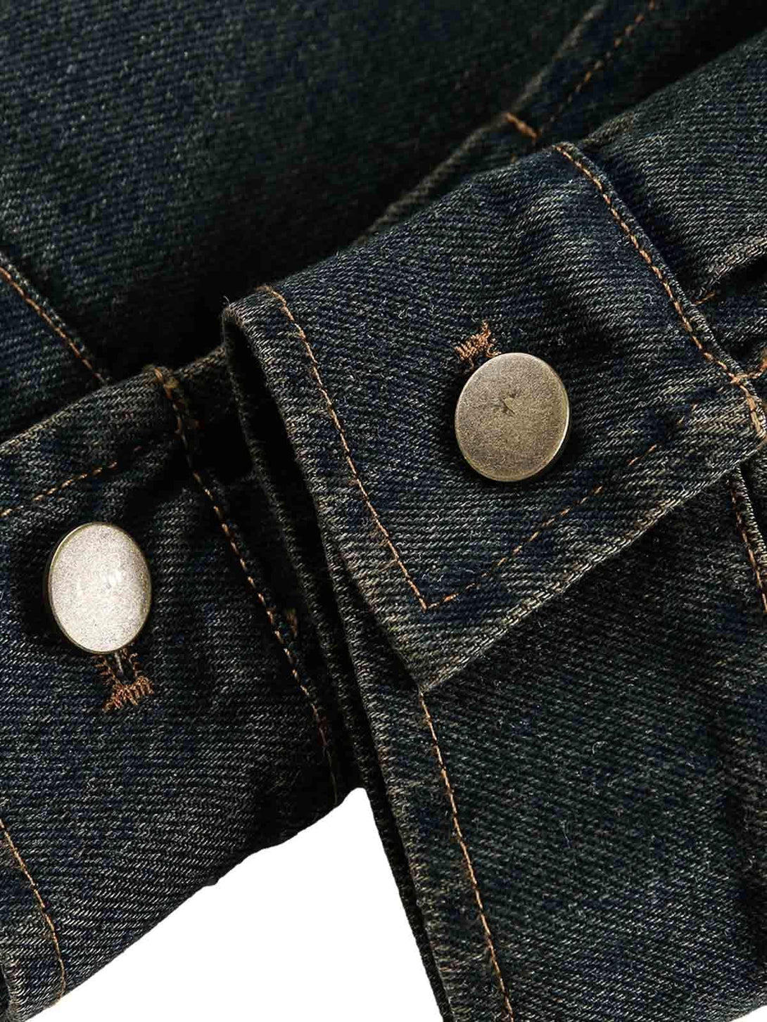 Focusing on the button detail of a TALISHKO washed distressed denim jacket, highlighting craftsmanship.