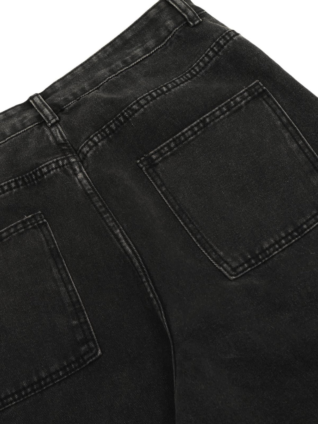 A close-up of TALISHKO's black washed cargo jeans, showcasing the back pocket details.