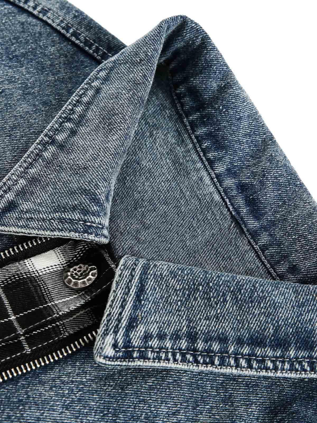 Detailed fabric and stitching of TALISHKO's faux two-piece denim jacket with plaid accents.