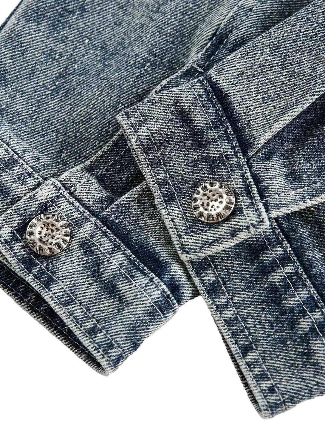 Detailed view of TALISHKO's denim jacket cuffs, showcasing unique button details and texture.