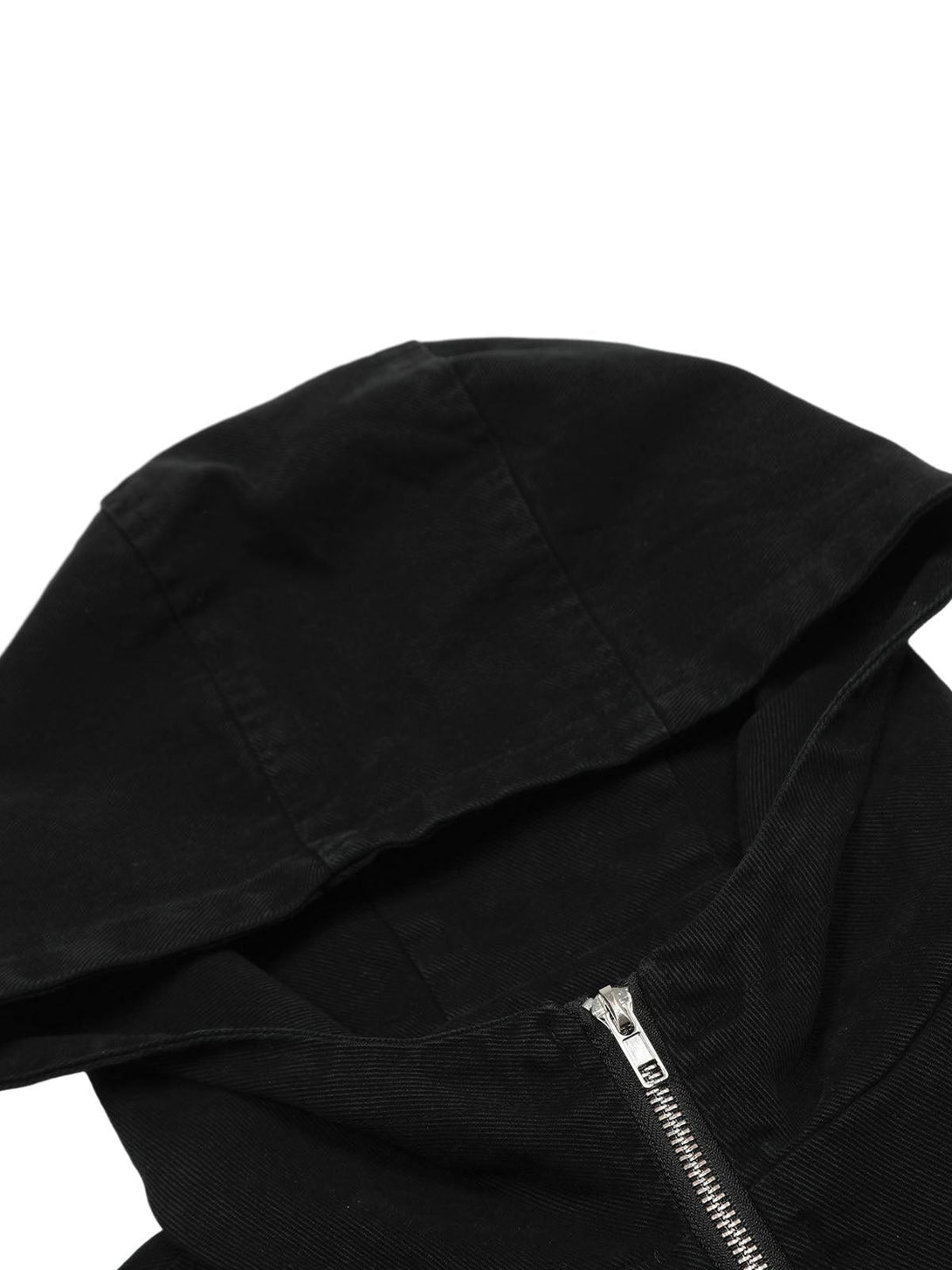 Intricate look at TALISHKO's black hooded jacket, focusing on the sleek zipper detail.