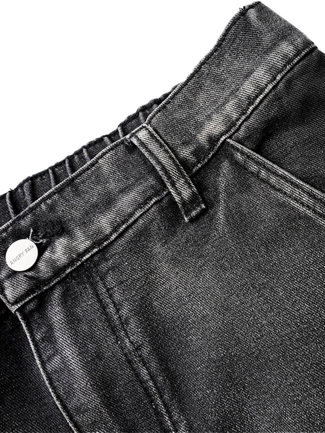 A close-up of TALISHKO washed distressed pleated cargo jeans, showcasing detailed stitching.