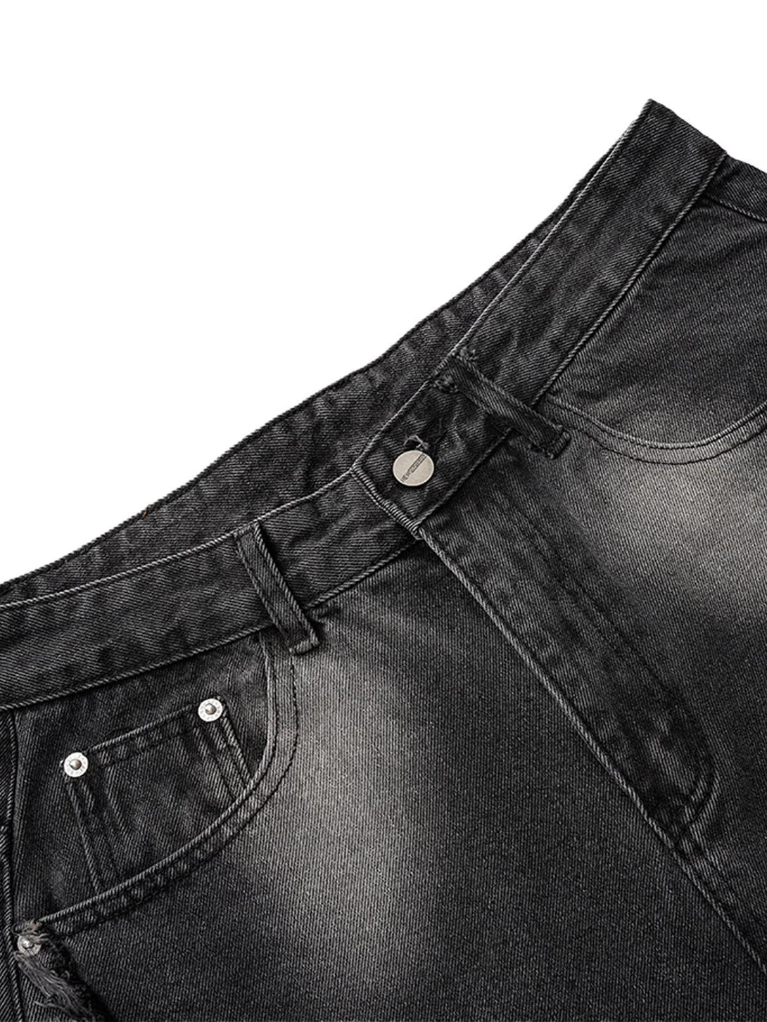A detailed view of washed barrel jeans by TALISHKO, highlighting distressed texture and raw edges.