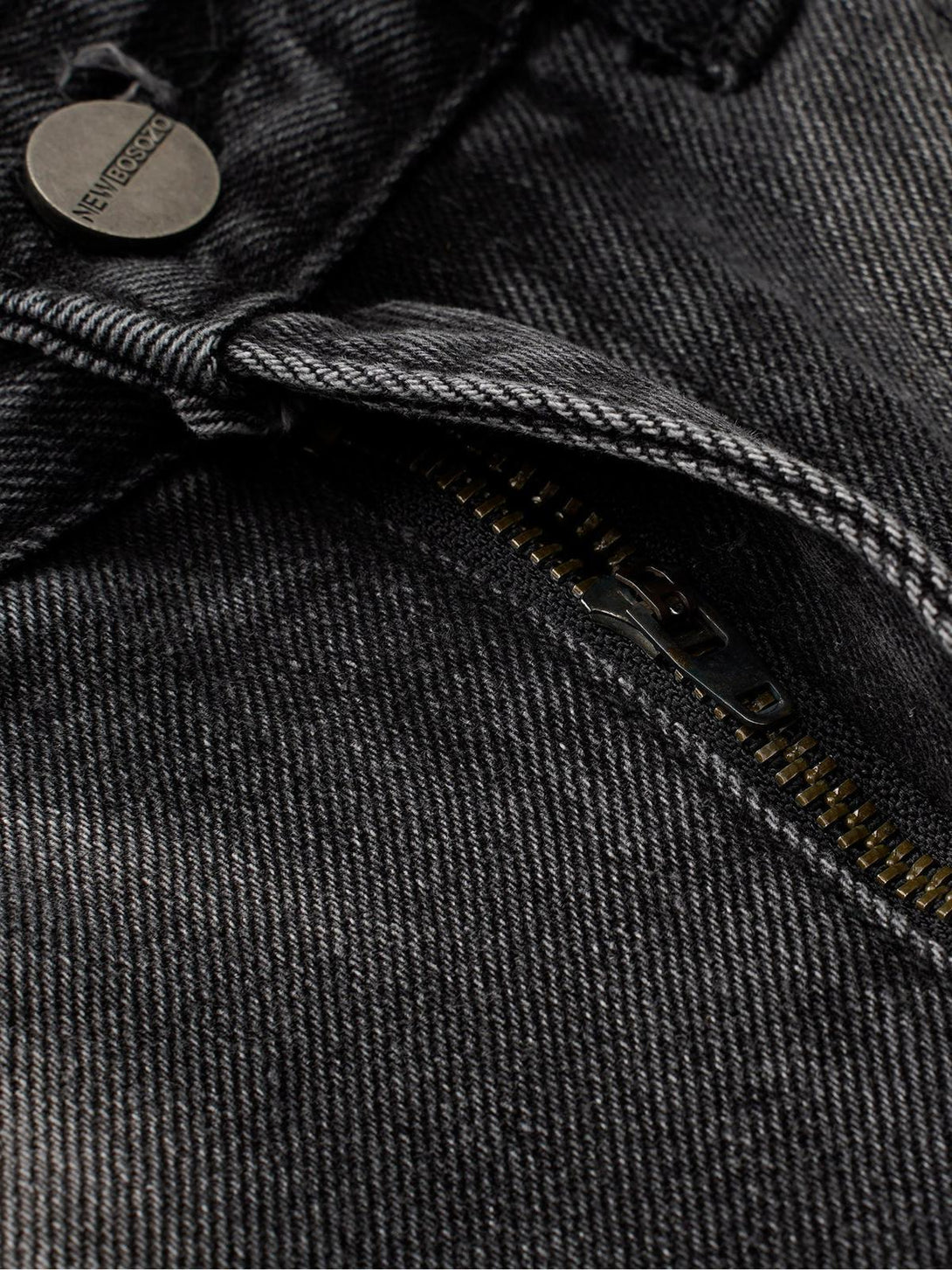 Focusing on TALISHKO jeans, showcasing zipper detail and distressed fabric texture.