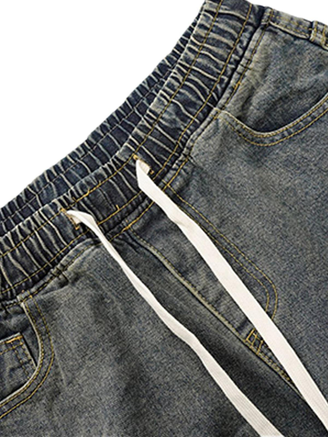 A close-up of TALISHKO barrel jeans, highlighting the elastic waistband and drawstring detail.