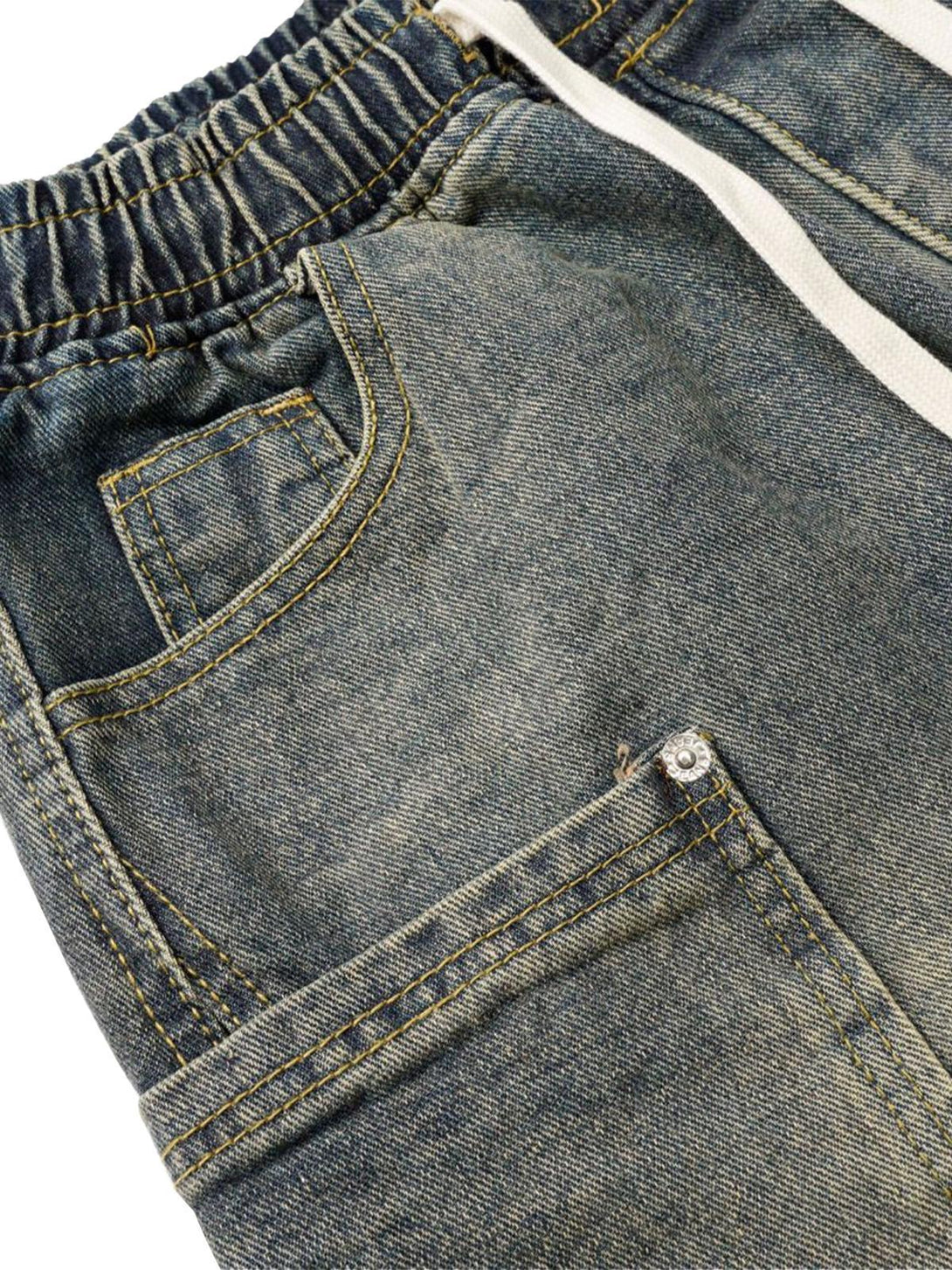 Focusing on the textured stitching and pocket detail of TALISHKO barrel jeans.