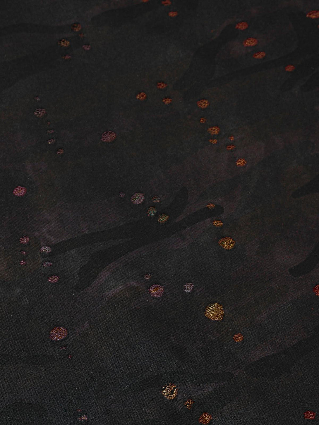 Intricate pattern detail on TALISHKO's washed distressed jacket, showcasing colorful textures.