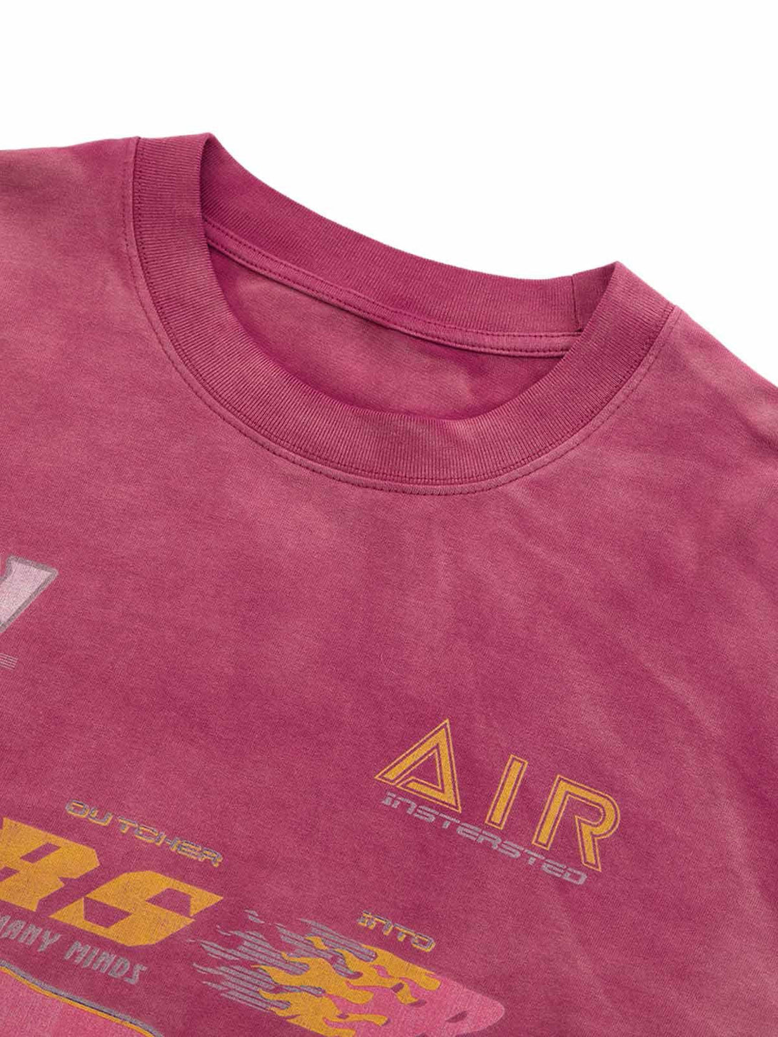 A tight crop highlighting the washed-edge long sleeve T-shirt by TALISHKO with graphic accents.