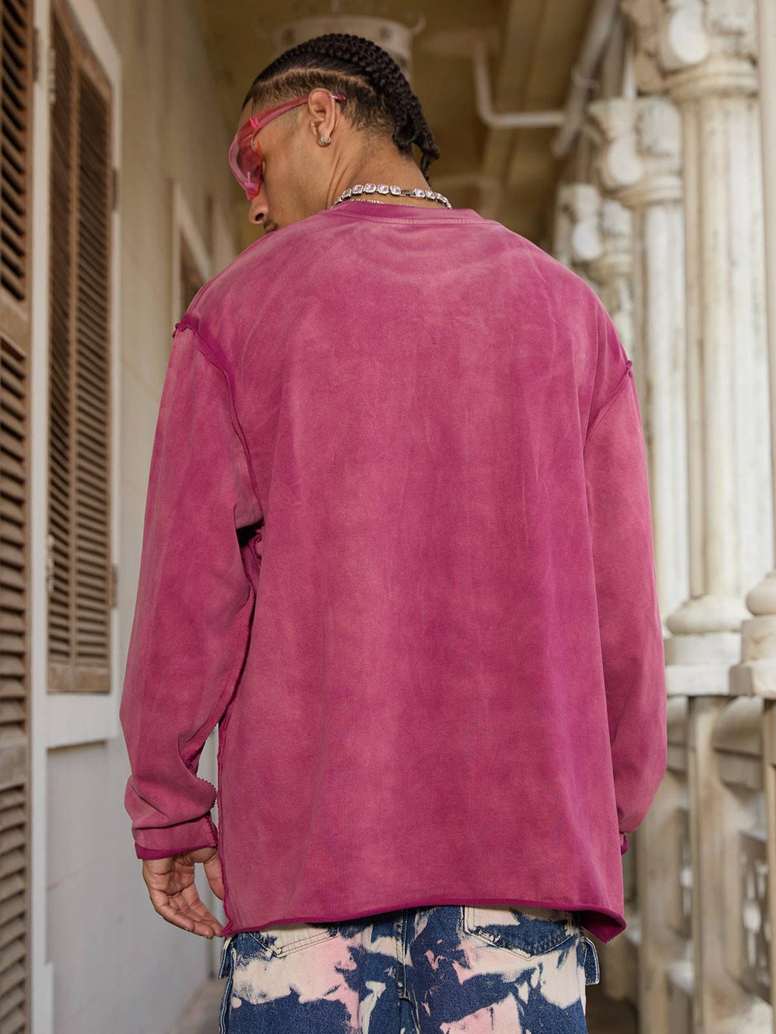 Model in a rose washed-edge long sleeve by TALISHKO, showcasing a casual summer vibe.