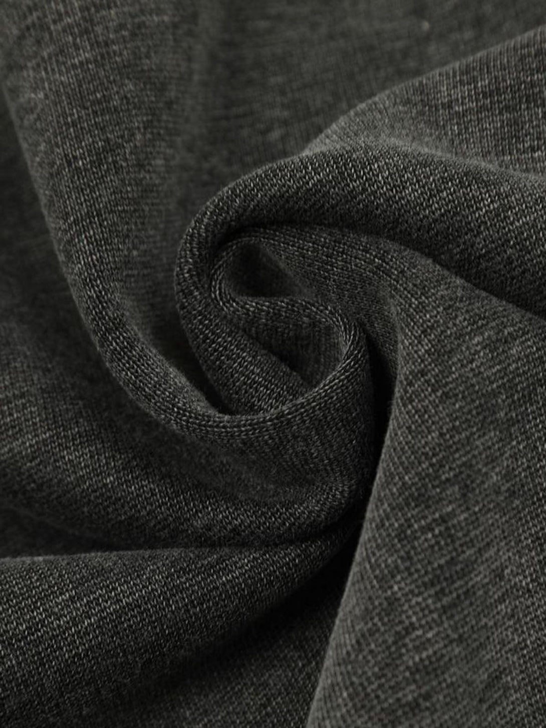 Zoomed-in texture of a washed fabric on a TALISHKO hoodie, highlighting its soft material.
