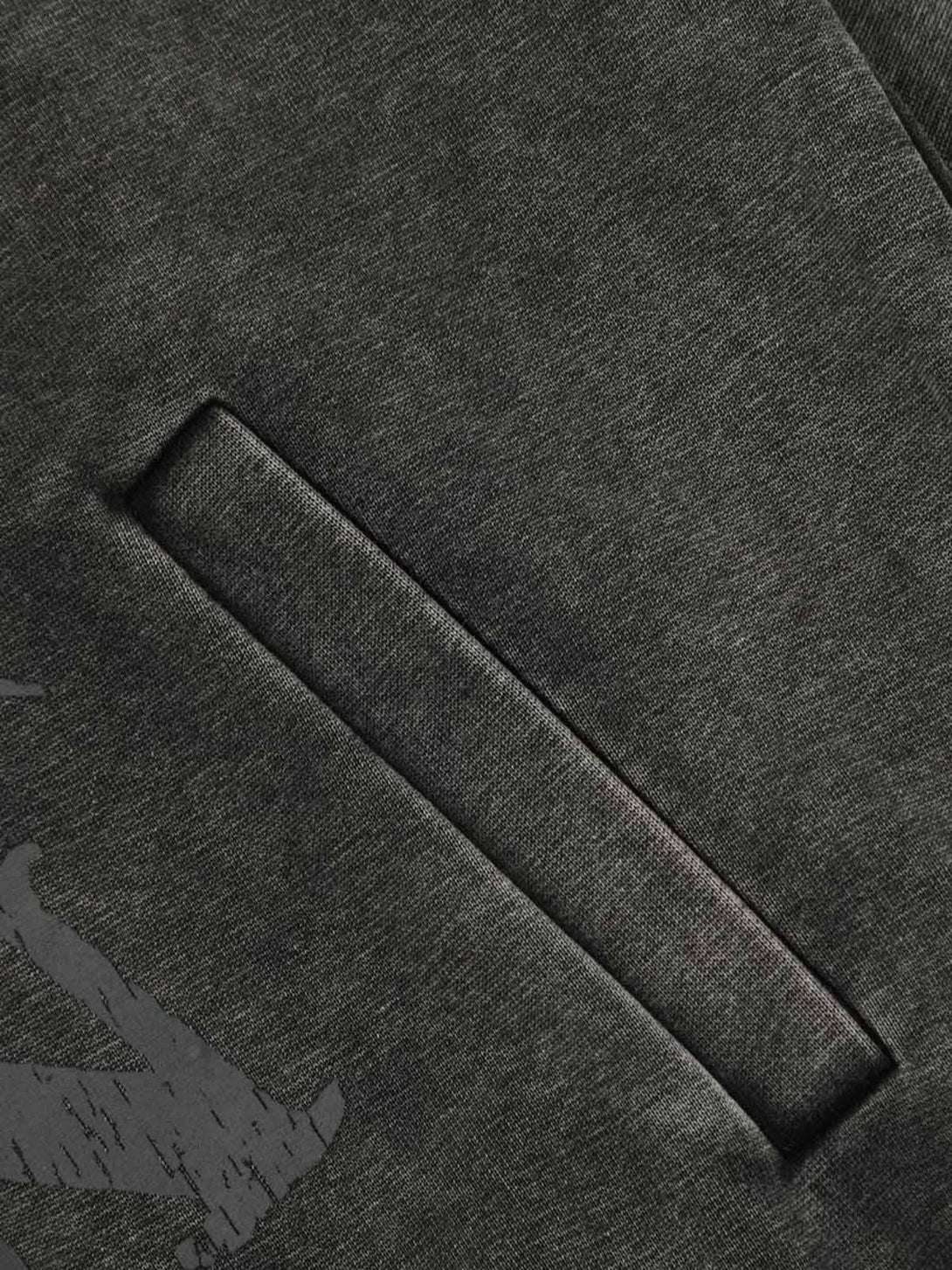 A detailed view of the pocket and texture on a TALISHKO washed hoodie, highlighting craftsmanship.