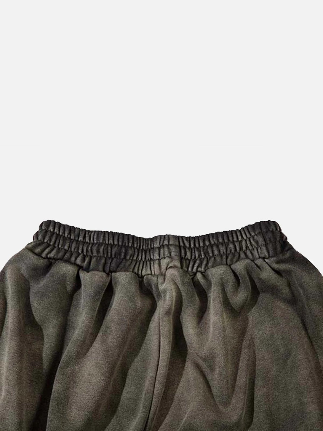 Detailed view of TALISHKO washed gradient drawstring sweatpants, highlighting fabric texture.
