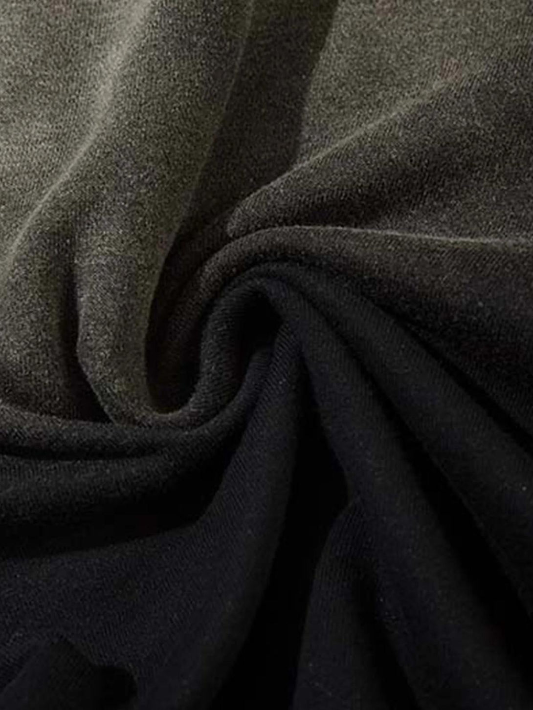 Zoomed-in texture of TALISHKO washed gradient sweatpants, showcasing soft fabric detail.