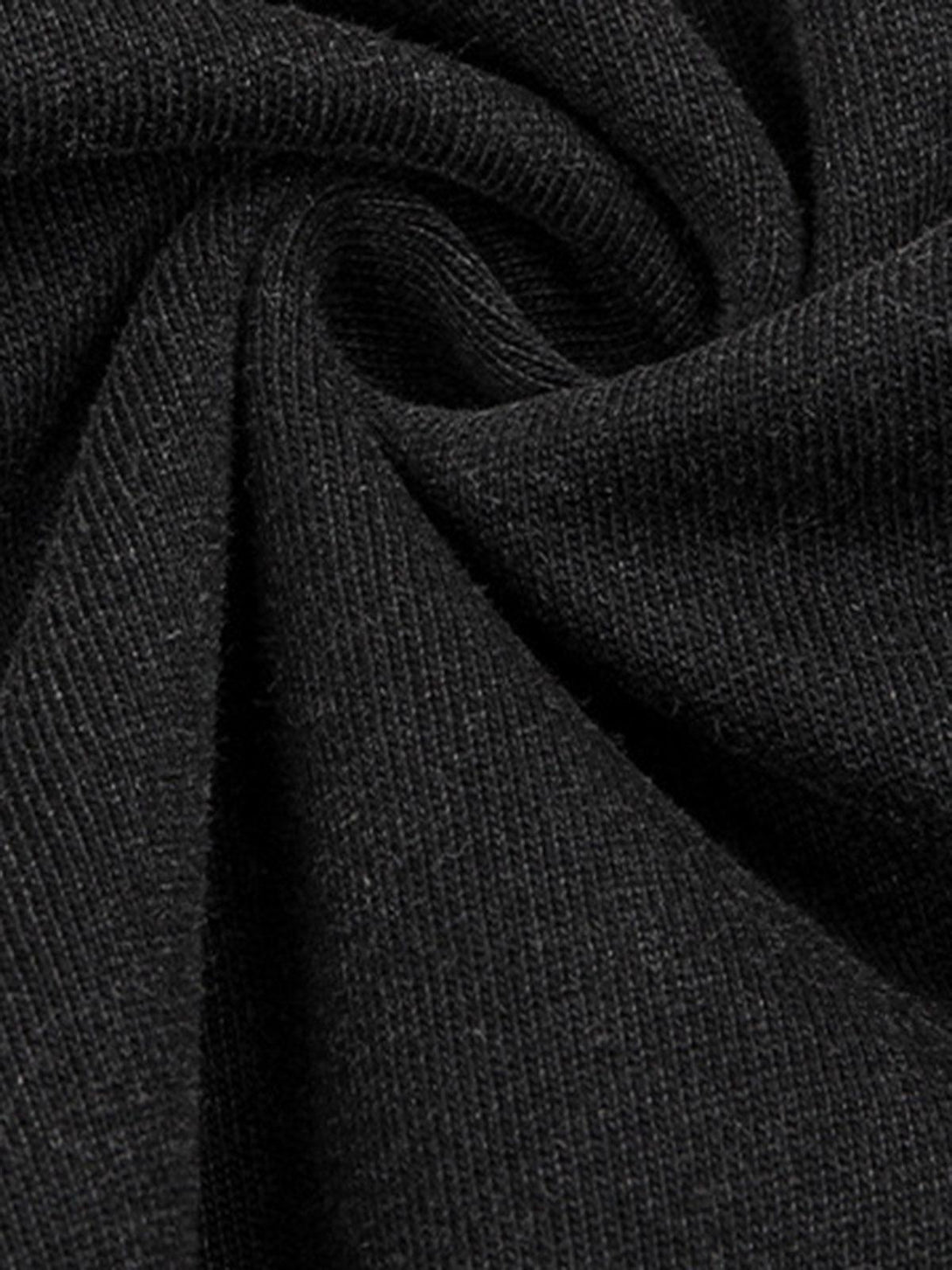 Zoomed-in texture of a black washed fabric from a TALISHKO crew neck T-shirt, showcasing quality material.