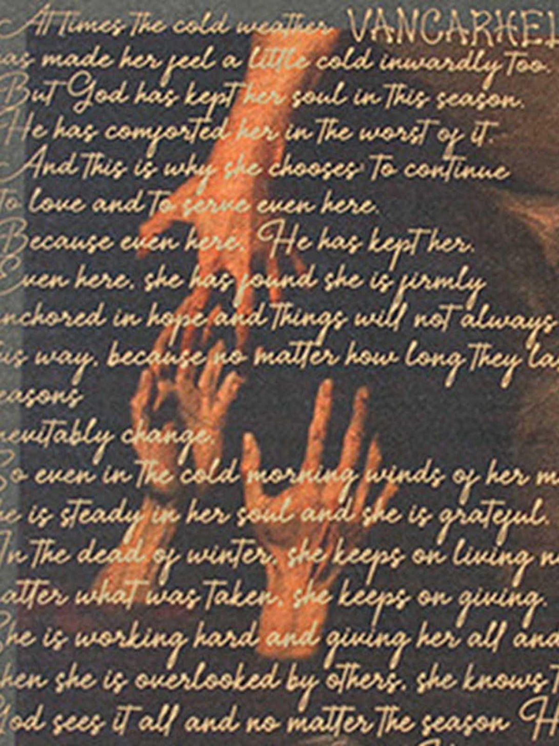 Zoomed-in view of the graphic design on a TALISHKO crew neck T-shirt, capturing a unique text motif.