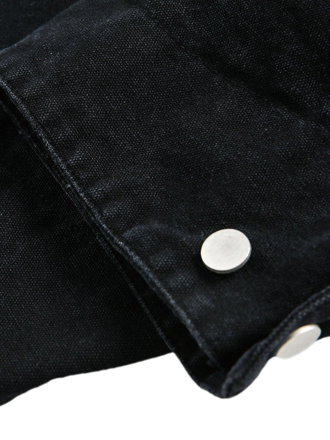 Detailed look at TALISHKO denim jacket's cuff, highlighting the sleek button detail.