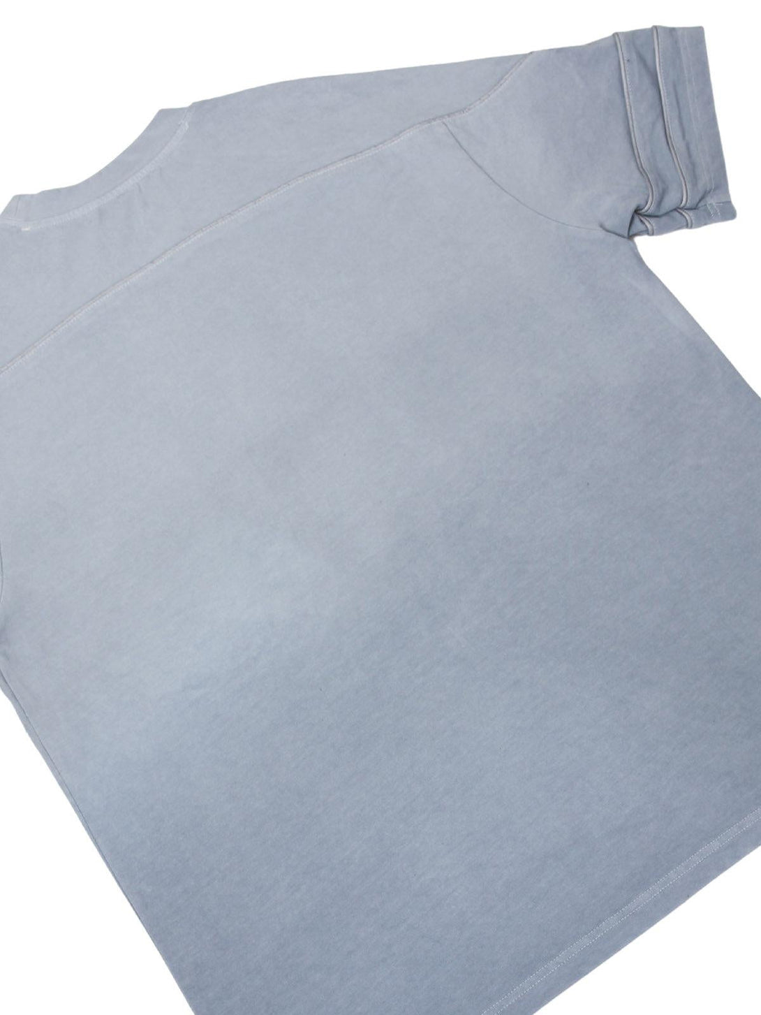 Back view of light blue washed jersey T-shirt by TALISHKO, featuring welt stitching detail.