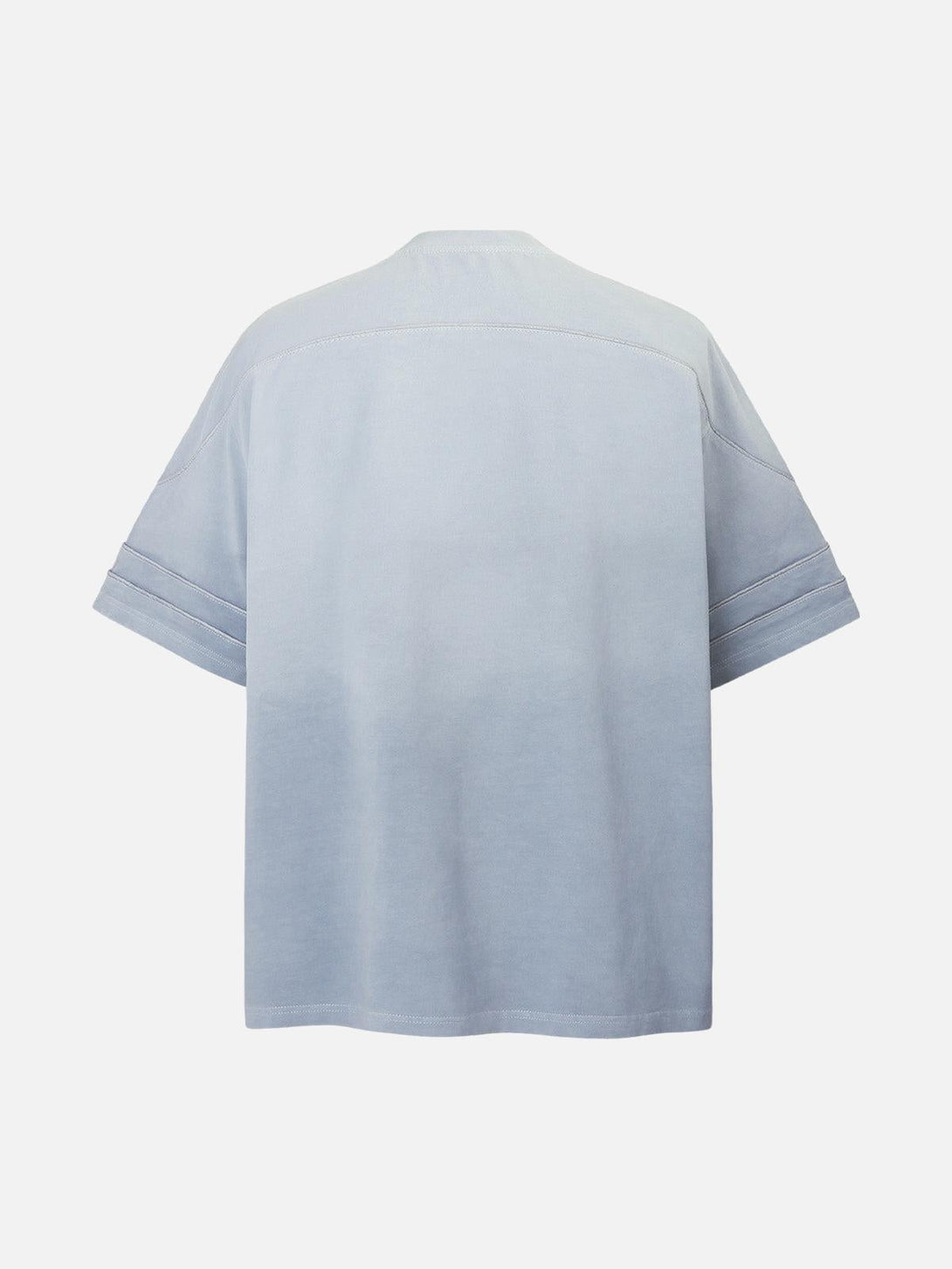 Back view of light blue washed jersey T-shirt by TALISHKO, showcasing welt stitching detail.
