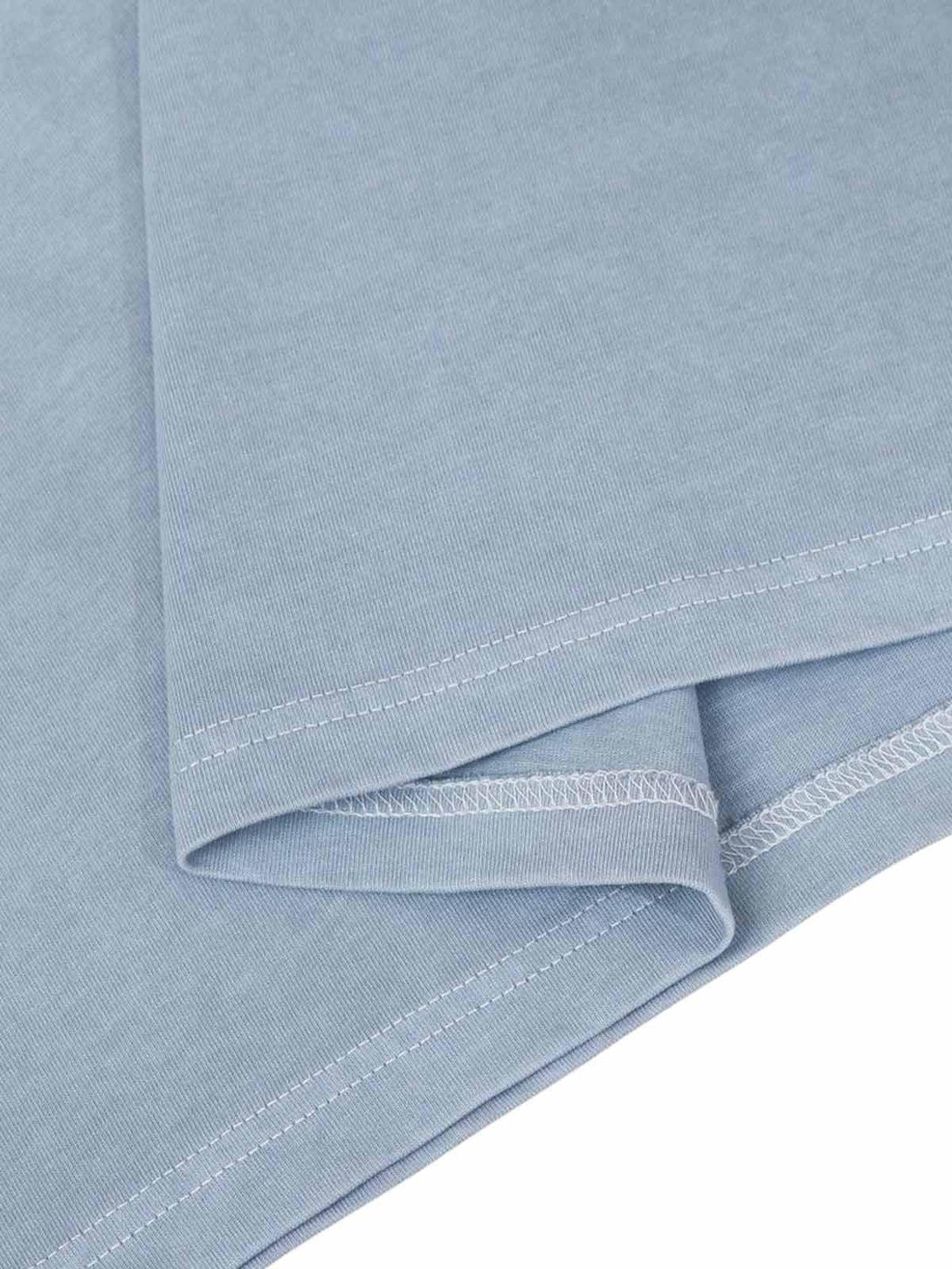 Intricate look at light blue jersey fabric by TALISHKO, emphasizing the welt stitching detail.