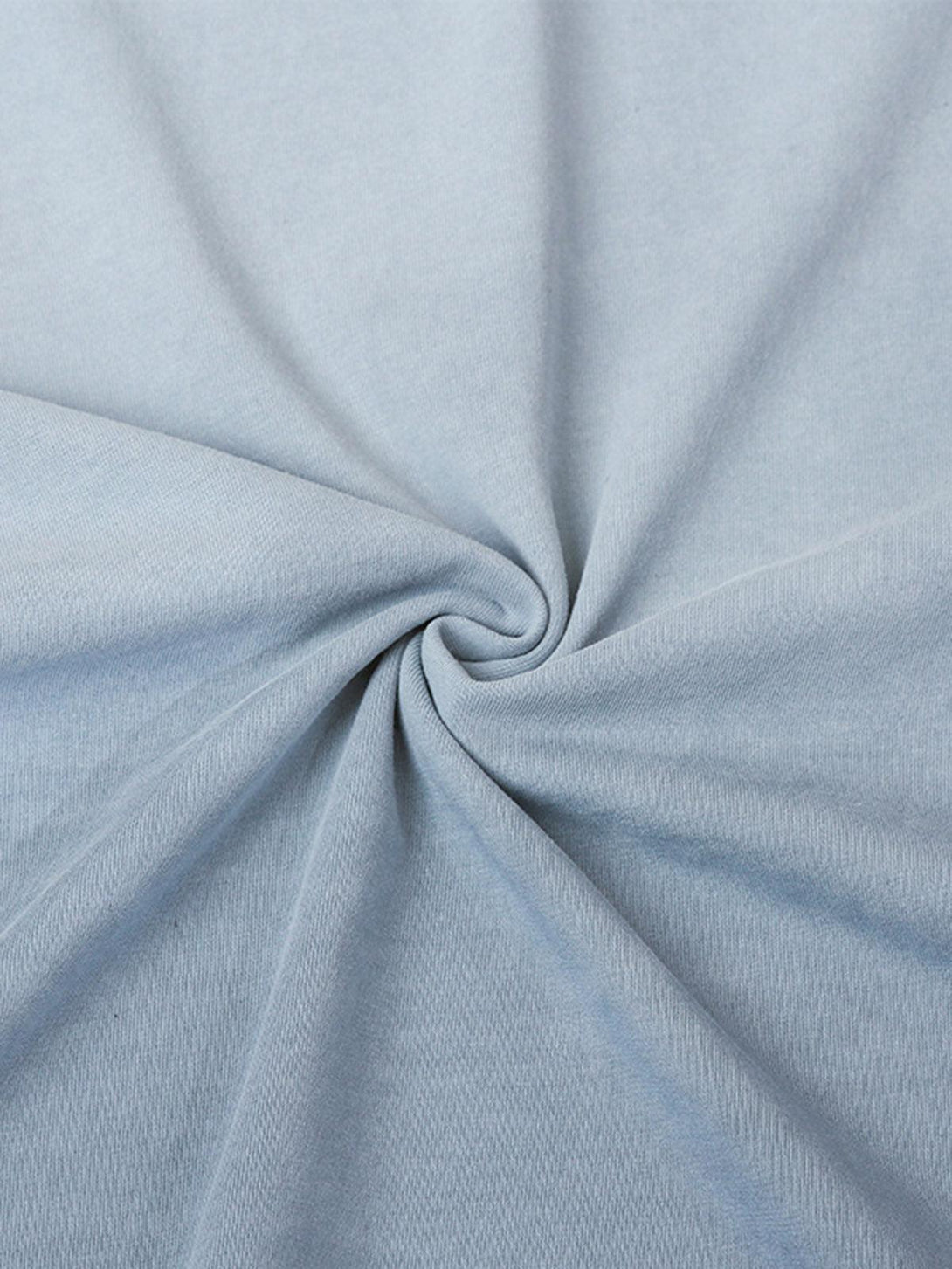 Zoomed-in texture of light blue jersey fabric by TALISHKO, highlighting welt stitching detail.