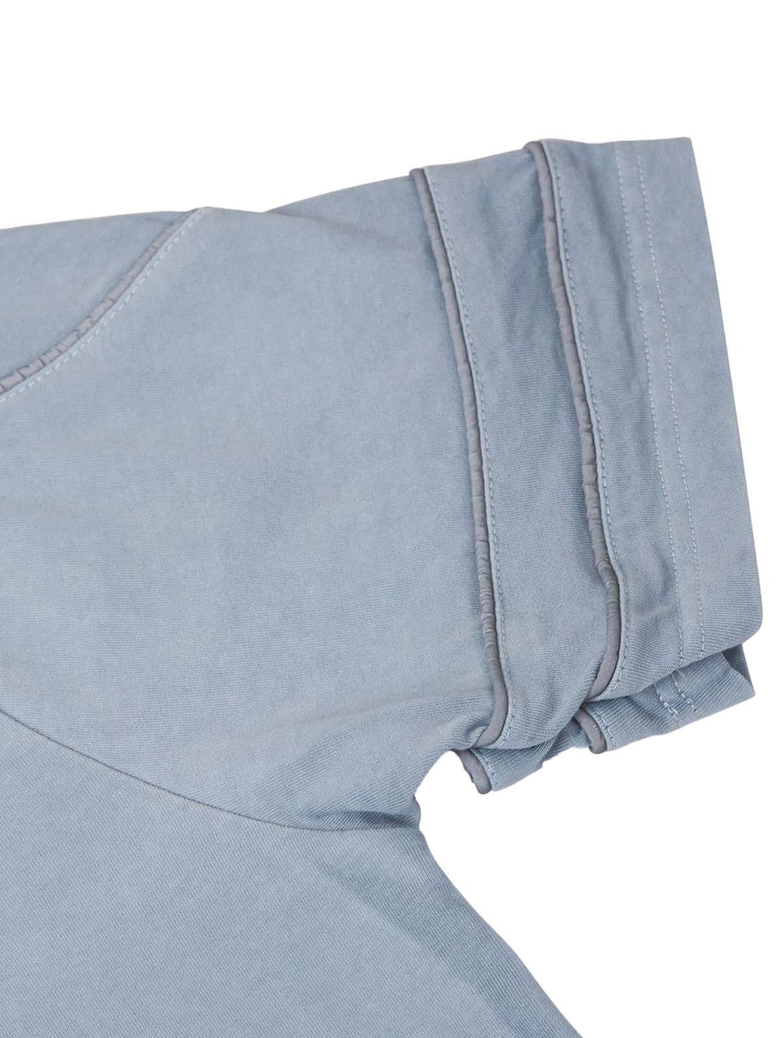 Detailed fabric and stitching of a washed jersey T-shirt by TALISHKO in light blue.