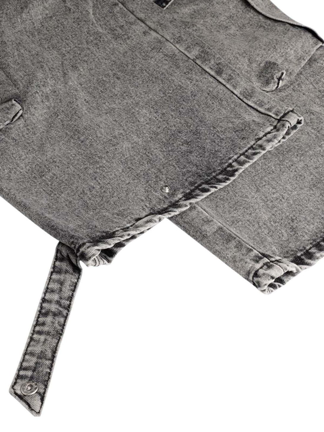 Detailed view of TALISHKO washed cargo jeans, showcasing intricate stitching and pocket design.