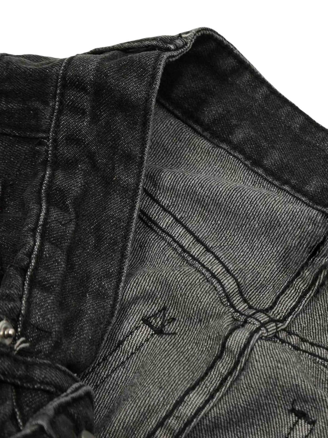 Intricate look at the interior stitching of TALISHKO's washed cargo jeans, highlighting craftsmanship.