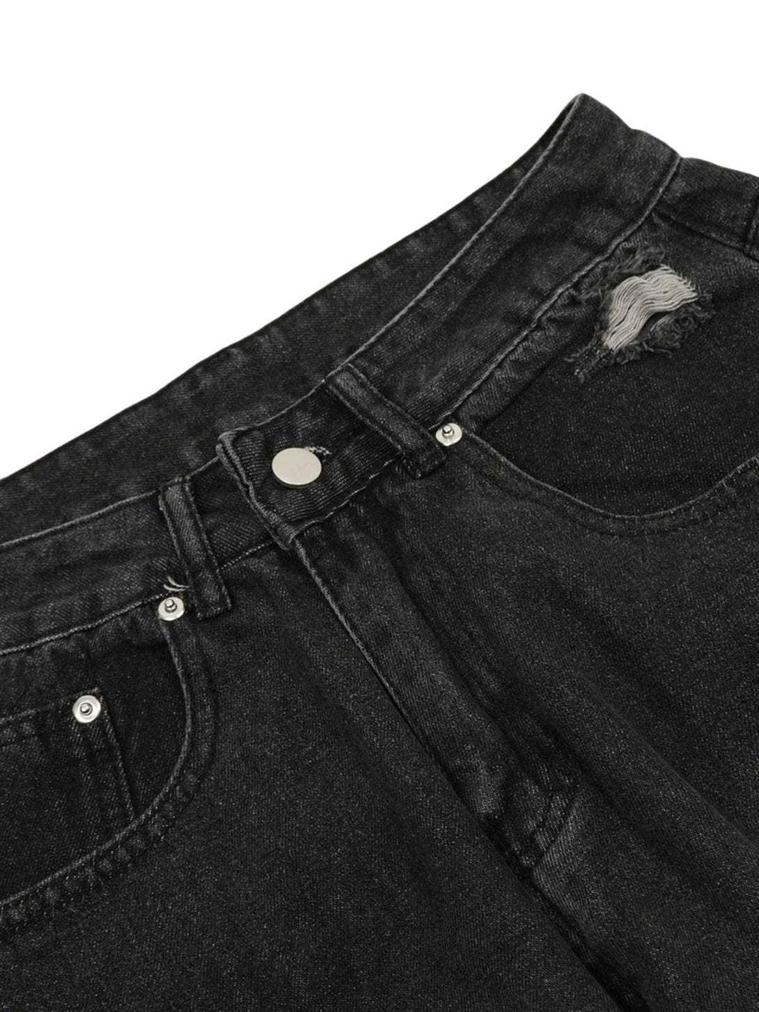 A detailed view of TALISHKO's black cargo jeans, showcasing distressed details and pockets.