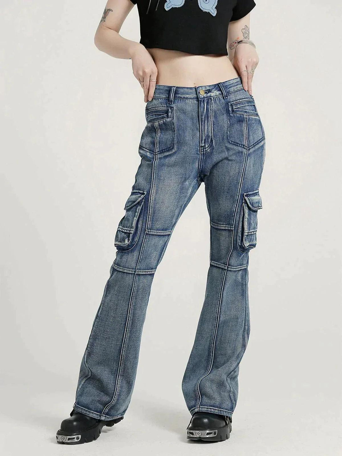 Model wearing washed old slim fit jeans by TALISHKO, highlighting cargo pockets and casual style.