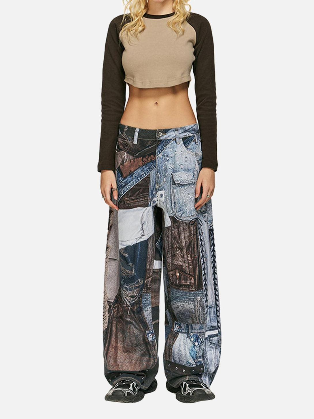 Model in TALISHKO baggy jeans with a patchwork design, paired with a cropped top for a trendy look.
