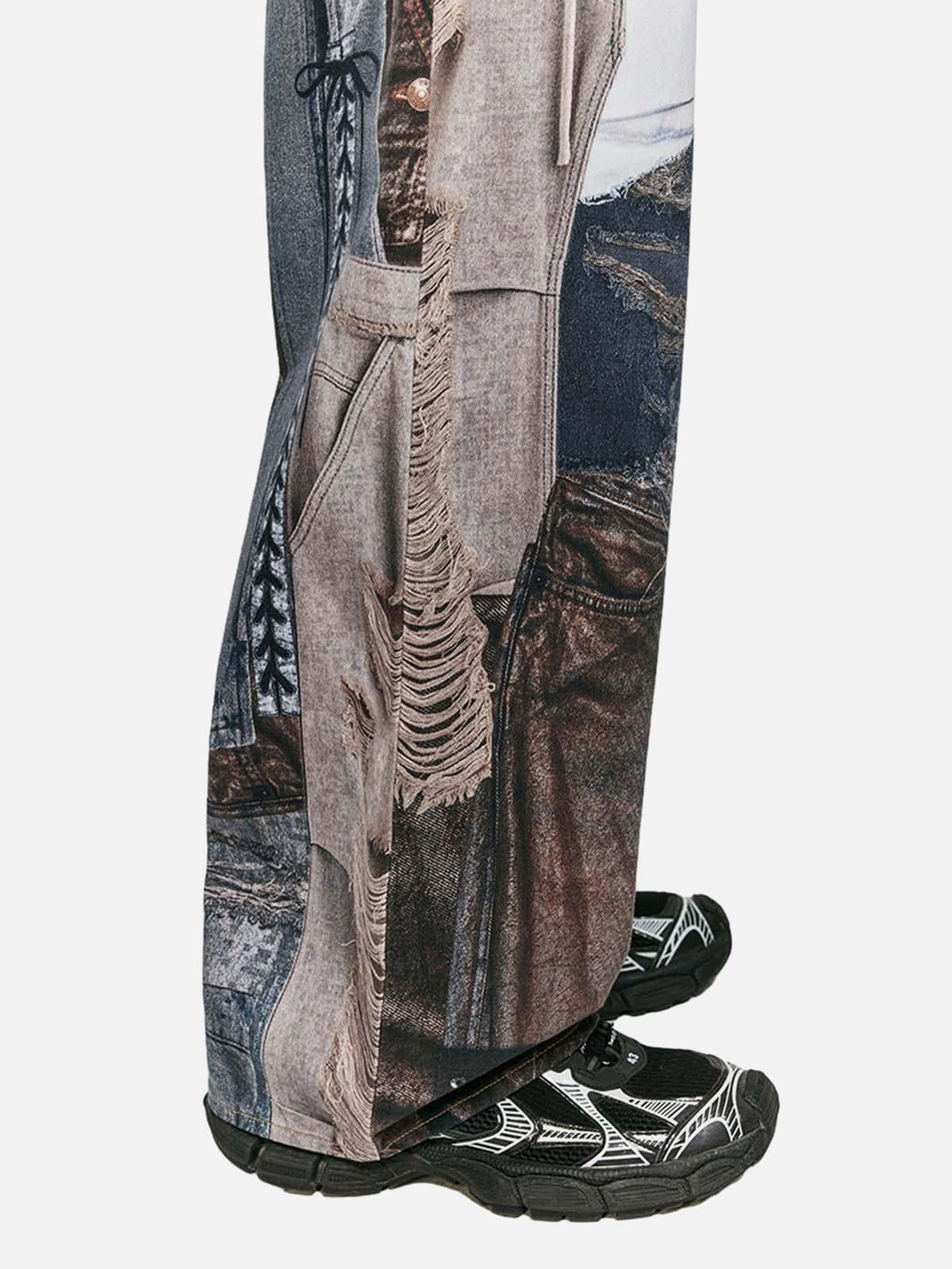 Side view of TALISHKO washed patchwork baggy jeans, highlighting intricate denim patterns.