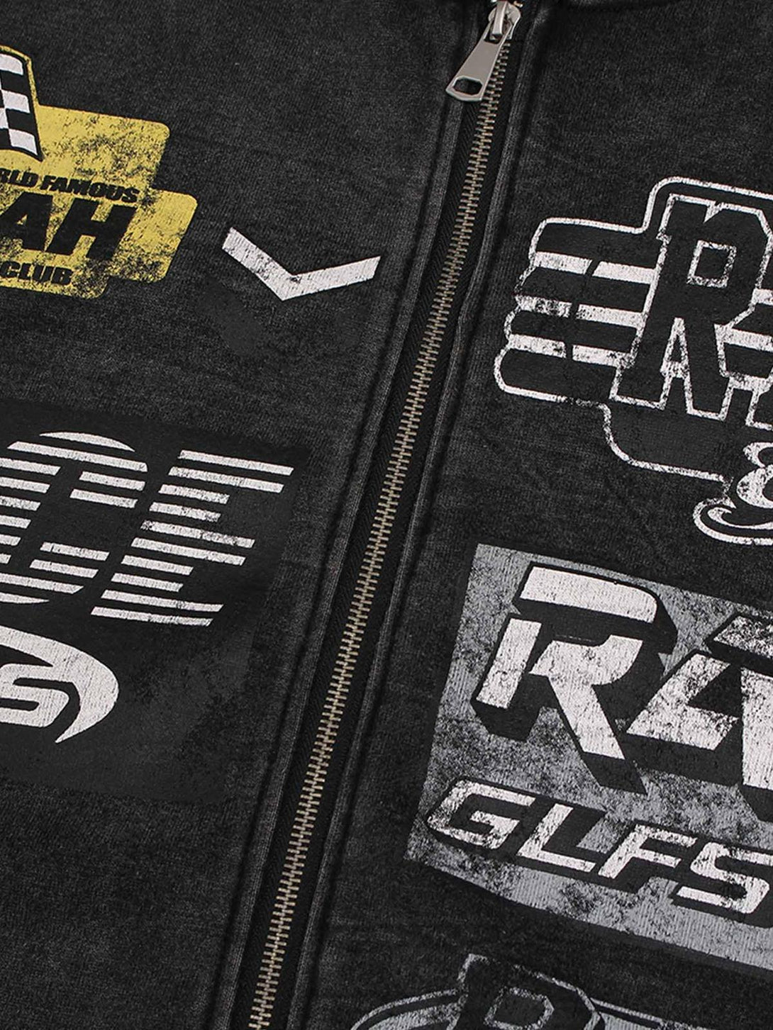 A close-up of TALISHKO's washed racing zip-up hoodie, highlighting bold graphics and zipper detail.