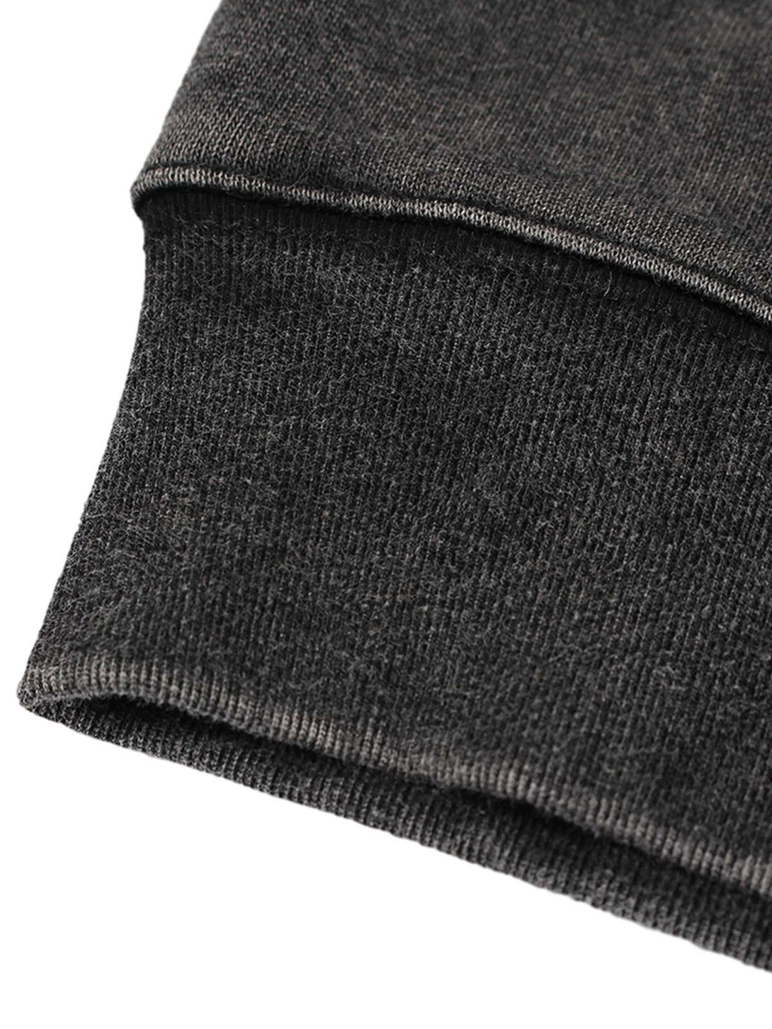 A detailed view of TALISHKO's washed racing hoodie sleeve, showcasing fine texture and stitching.