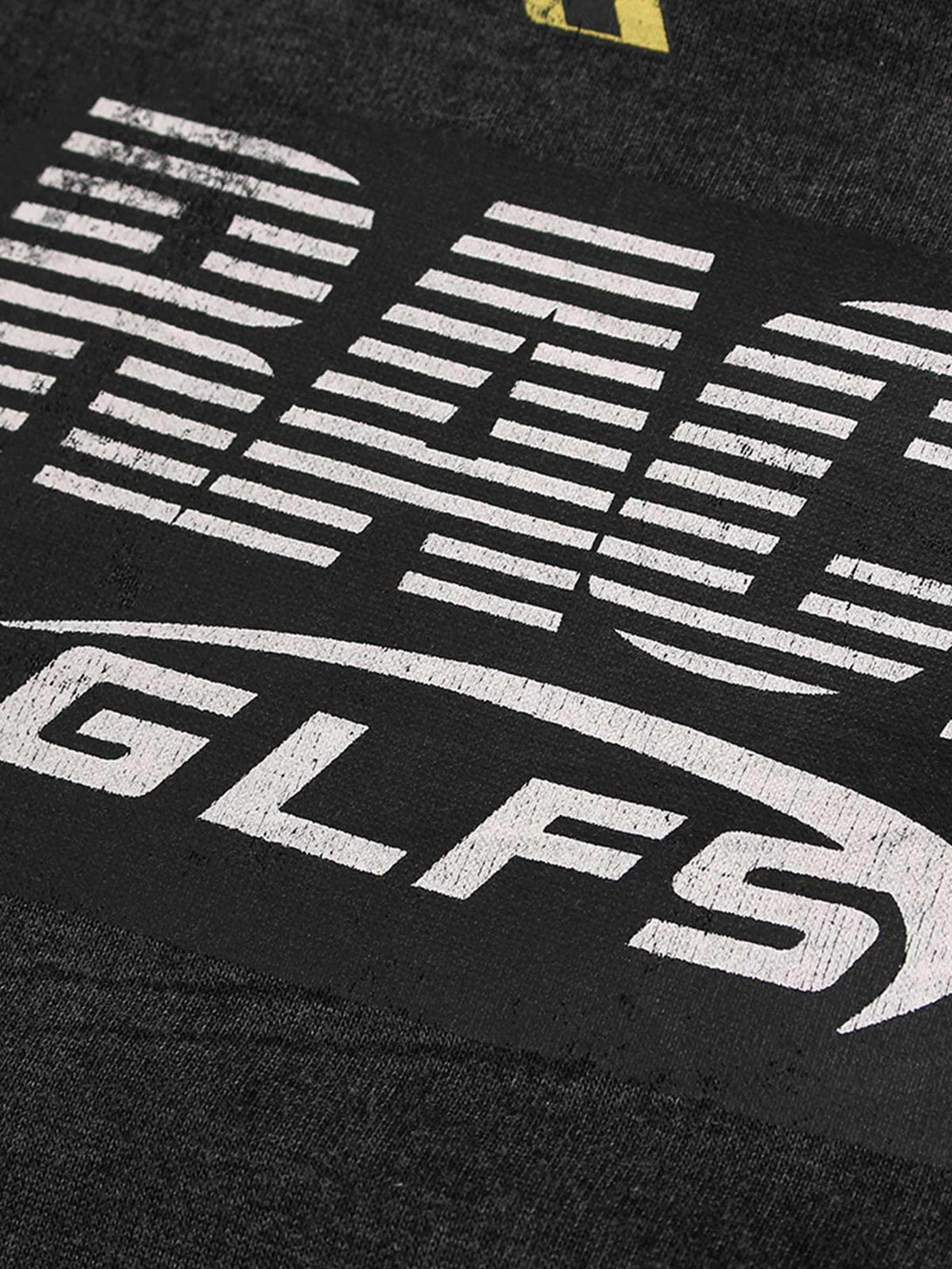 A tight crop highlighting the graphic design on TALISHKO's washed racing zip-up hoodie.