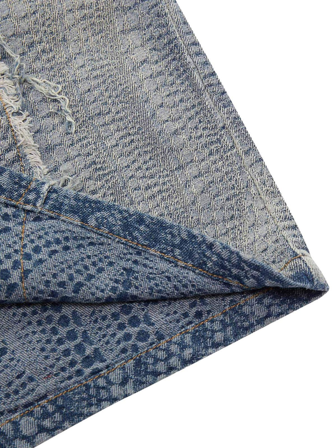Detailed fabric and stitching of a TALISHKO denim shirt, highlighting its unique texture and style.