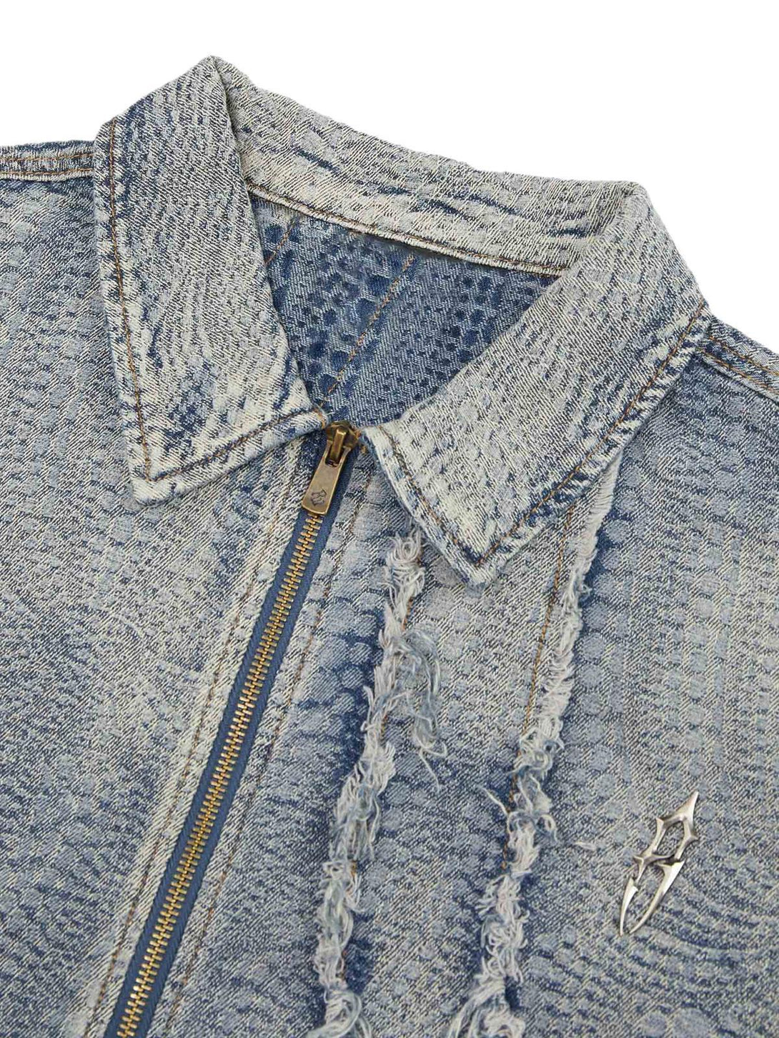 Intricate look at the textured fabric and raw edges of a TALISHKO denim shirt.