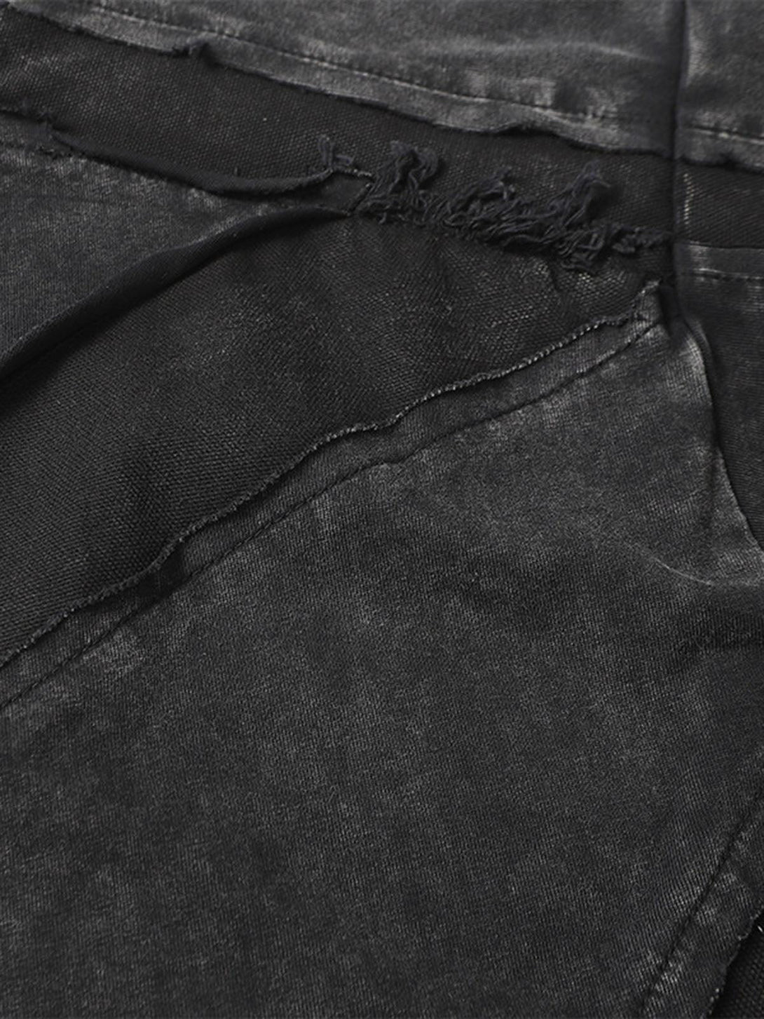 Intricate look at TALISHKO's washed oversized T-shirt, highlighting raw edge details.