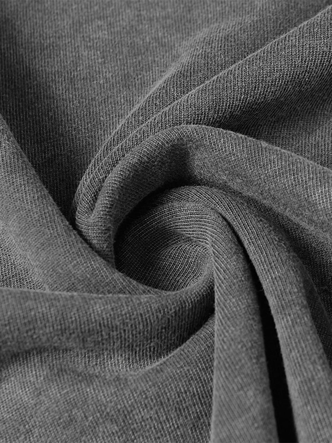 Zoomed-in texture of TALISHKO's gray oversized T-shirt, emphasizing the soft fabric and raw edges.