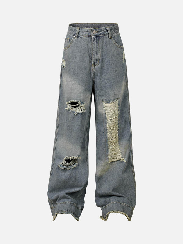 TALISHKO baggy jeans with a washed, ripped design, showcasing a relaxed, edgy style.