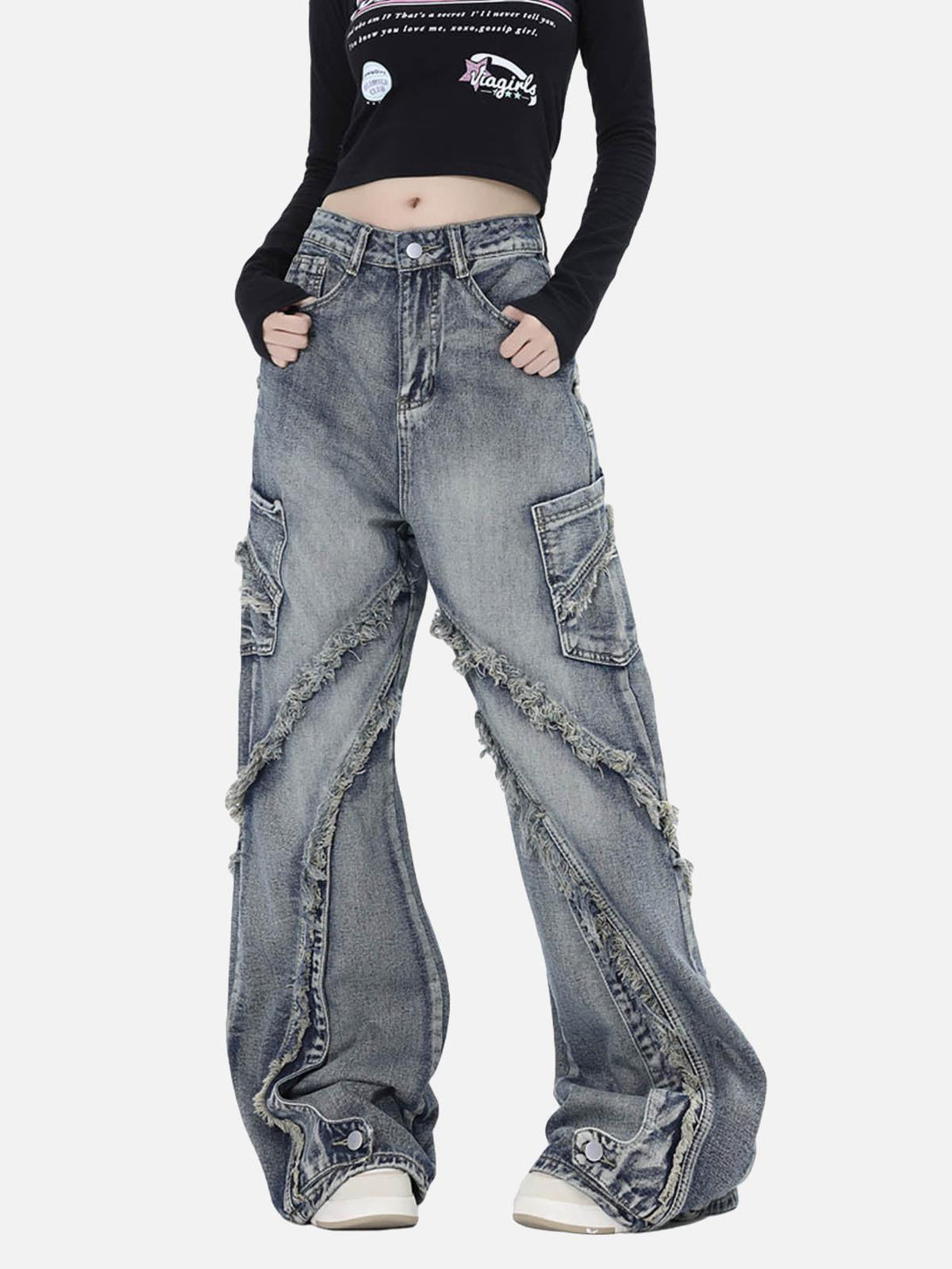 Model wearing TALISHKO baggy jeans with raw edges and side pockets, showcasing a casual look.