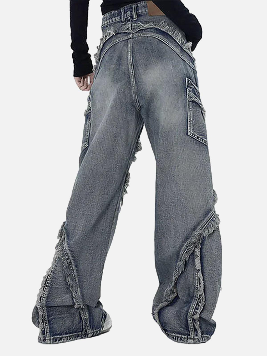 Back view of TALISHKO washed baggy jeans with raw edges and roomy side pockets.