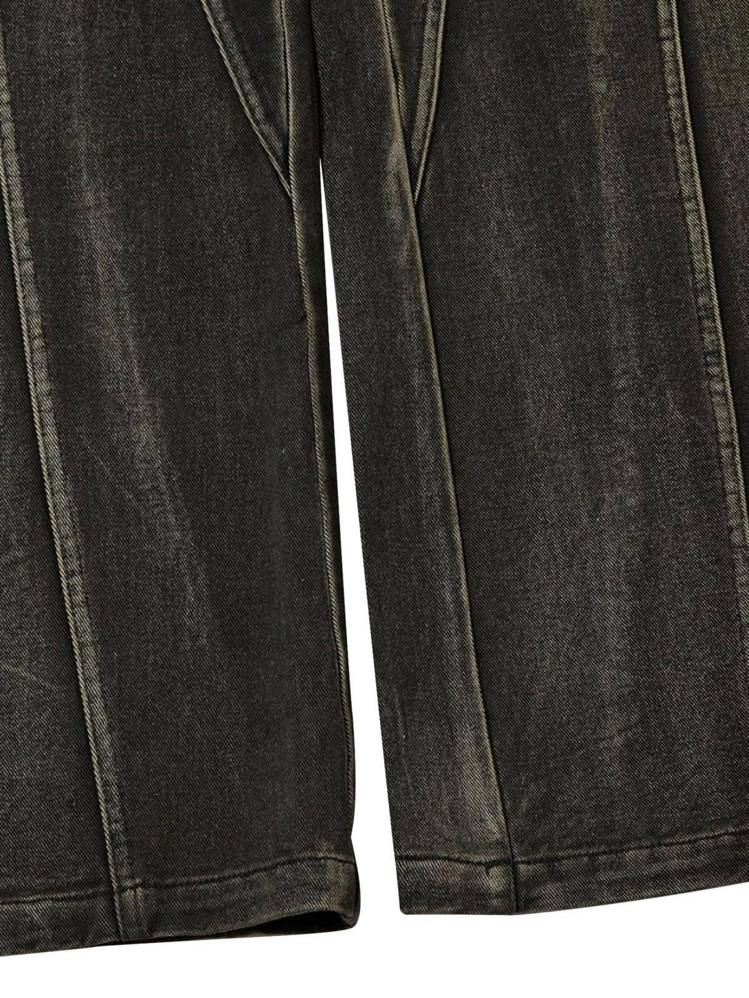 Detailed fabric and stitching of TALISHKO's washed hip-hop horn jeans, highlighting the split design.