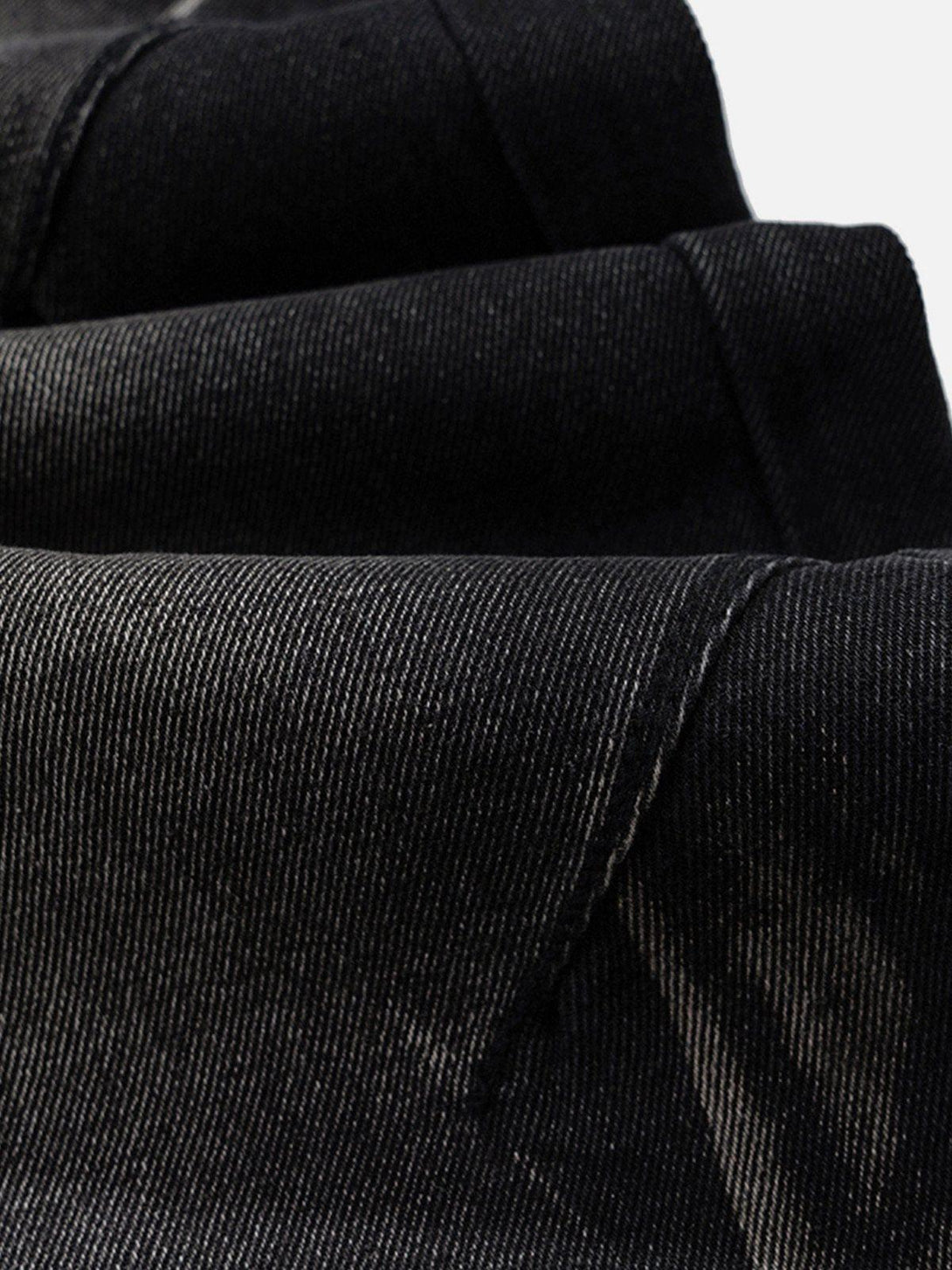 Detailed fabric and stitching of black washed wide-leg jeans by TALISHKO, emphasizing texture.
