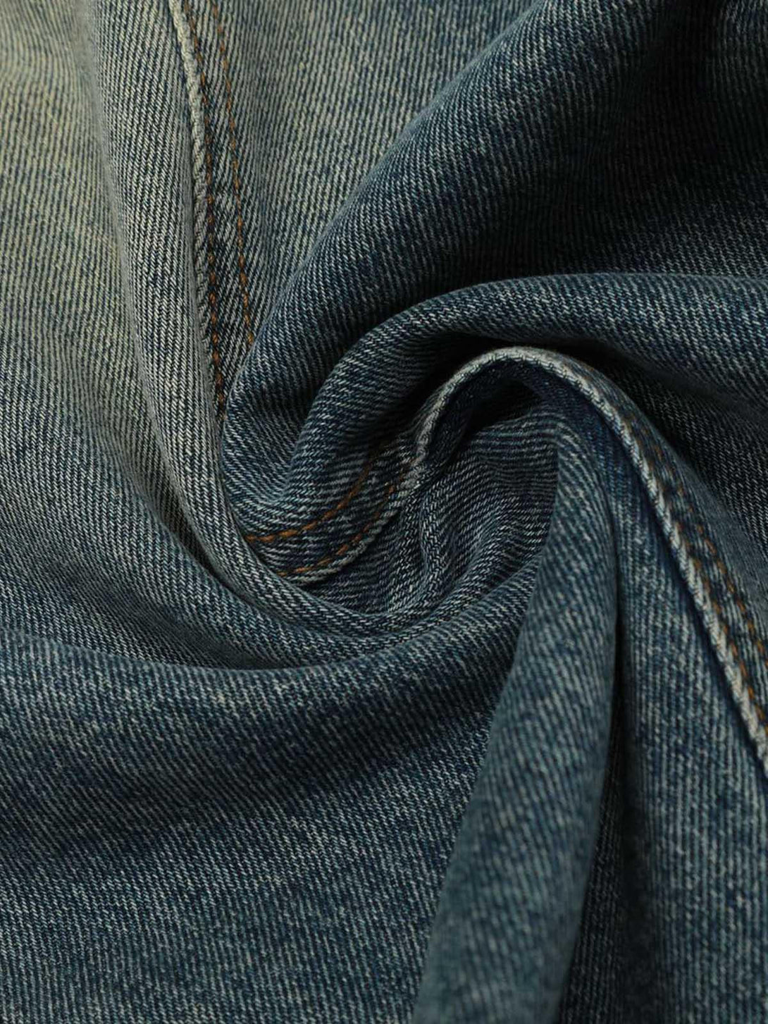 Texture and pattern showcased in TALISHKO washed wide-leg balloon jeans fabric.