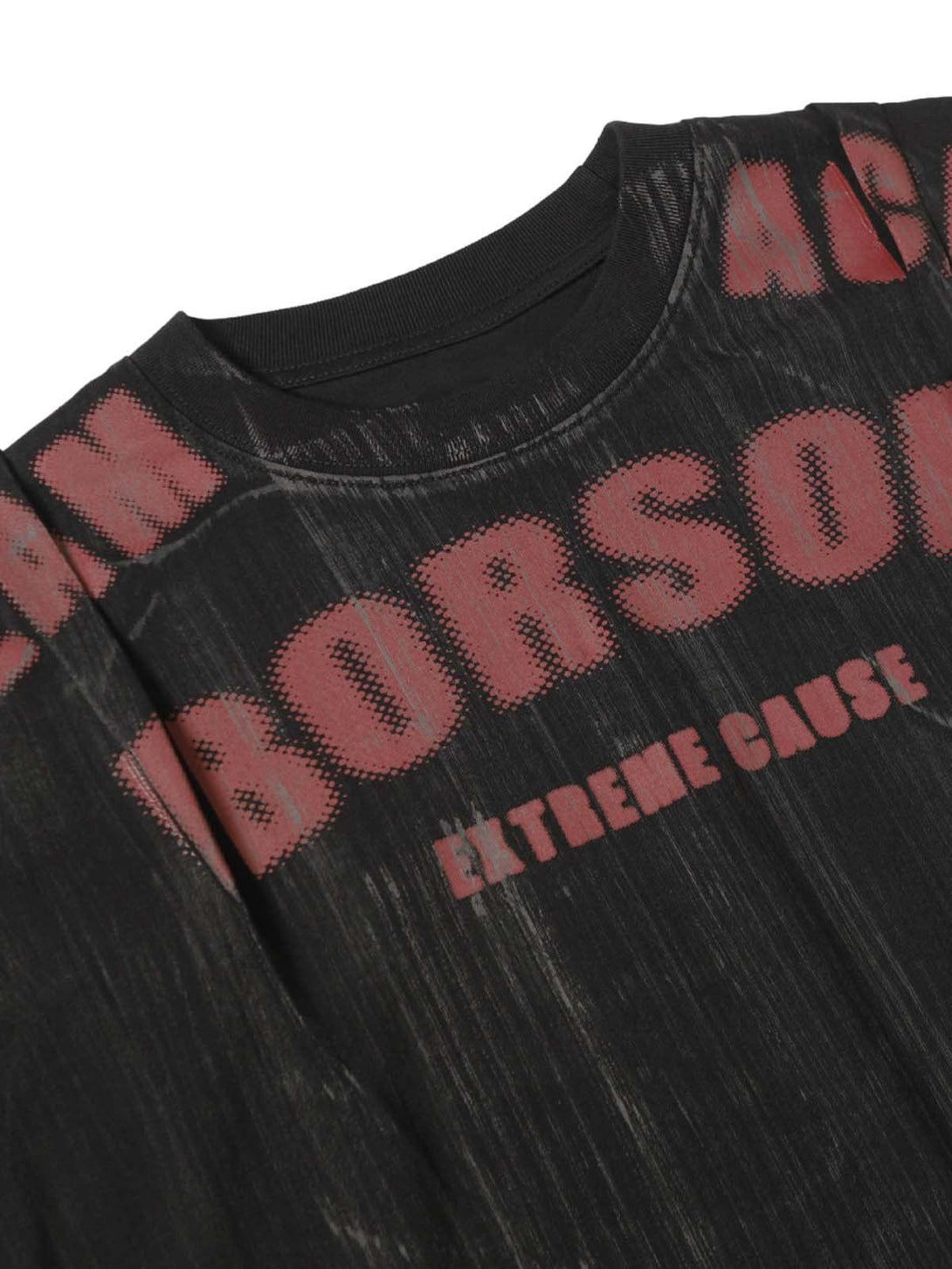 Detailed view of TALISHKO's oversized graphic T-shirt, highlighting bold red text and texture.