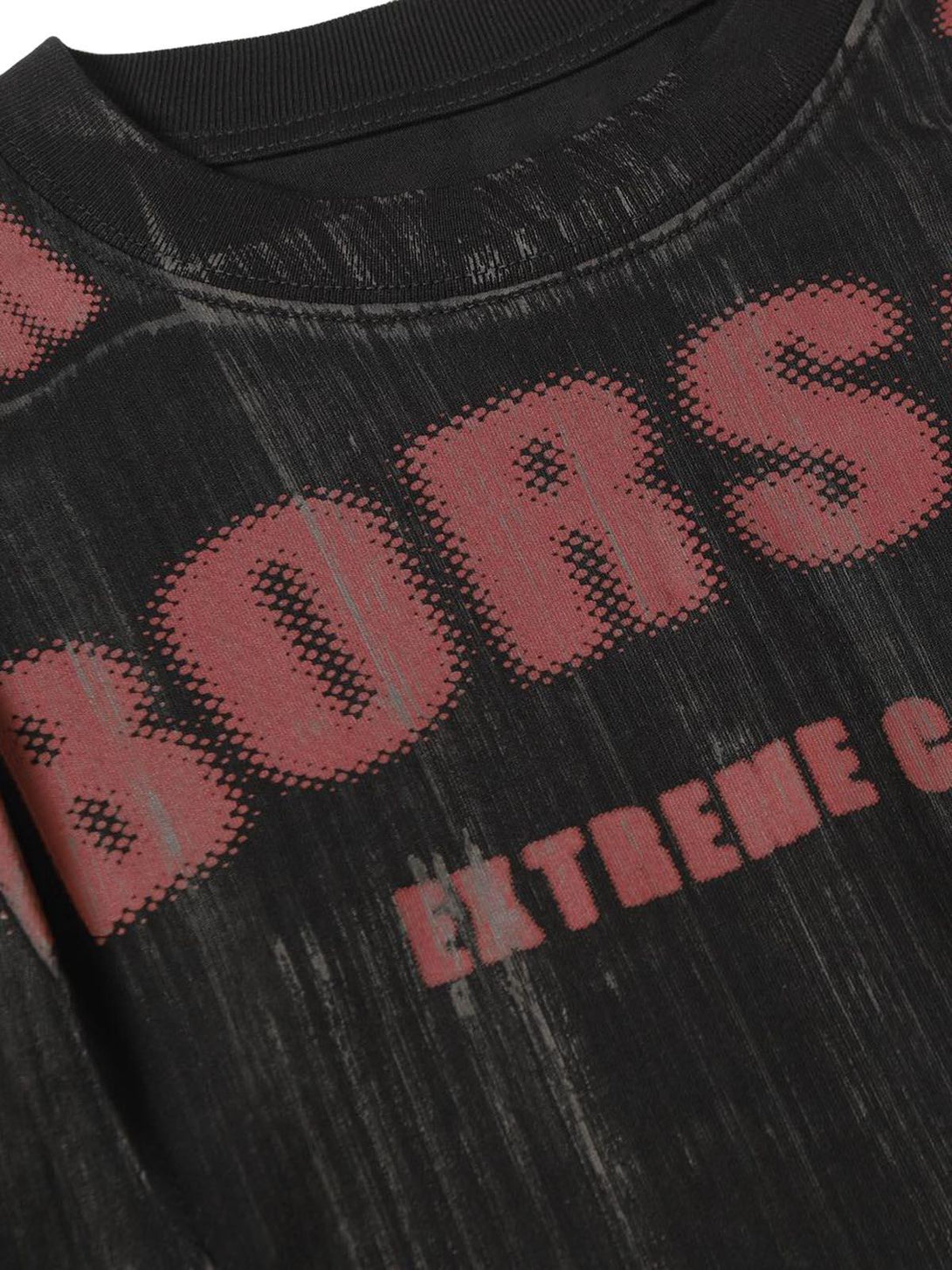Intricate look at TALISHKO's Wasteland Dirty Dye T-shirt, highlighting bold text and unique texture.