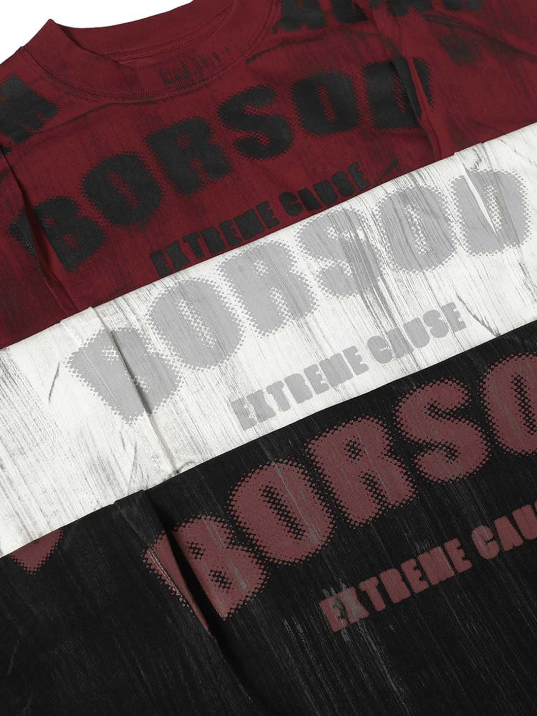 Bold graphic text and unique dye patterns on TALISHKO's oversized T-shirt in red, white, and black.