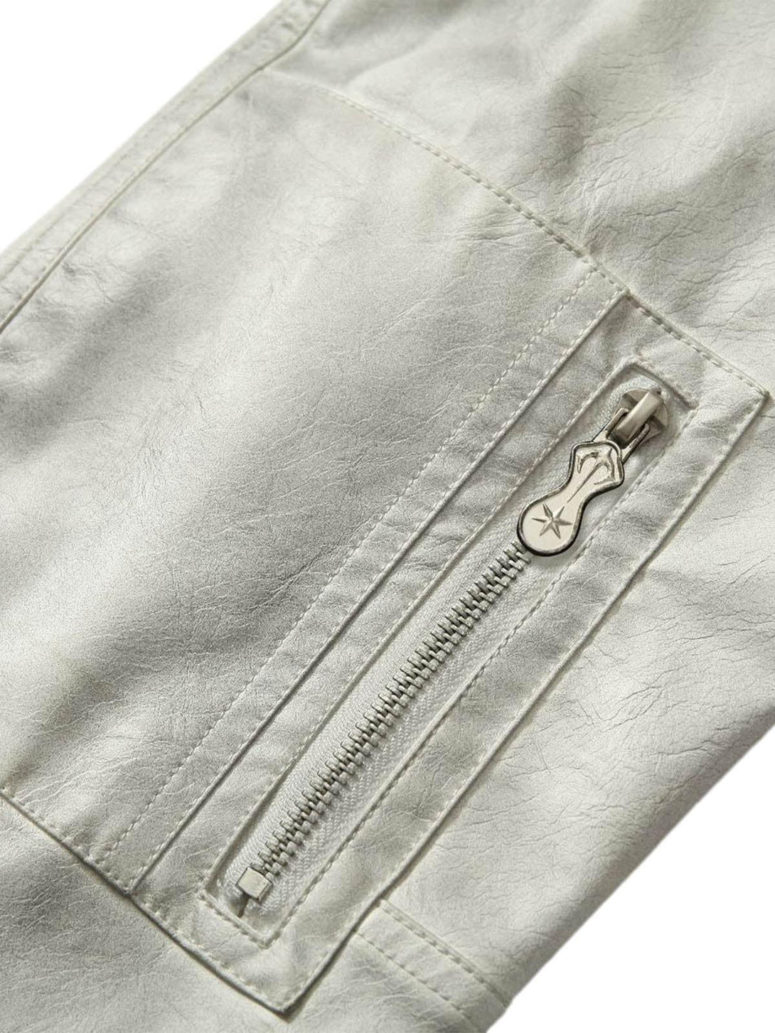 Focusing on the zip detail of TALISHKO's wasteland dyed leather bomber jacket.