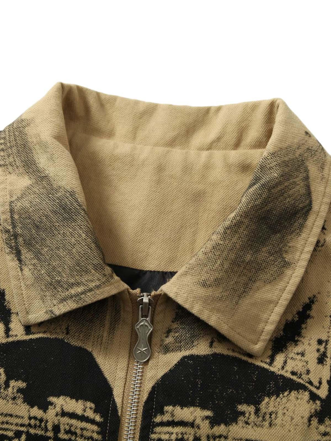 A detailed view of TALISHKO's jacket collar, showcasing patchwork graffiti and unique textures.